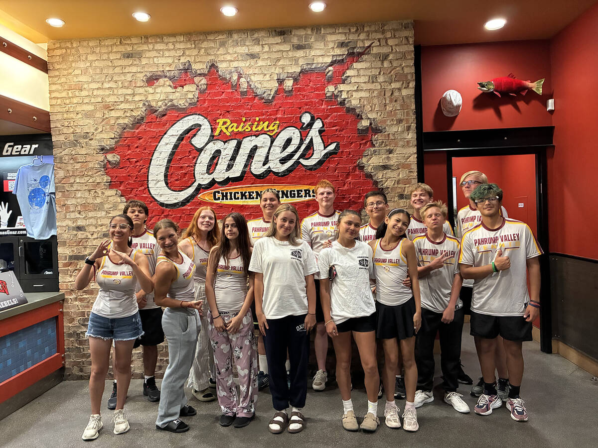 The Pahrump Valley High School tennis team enjoys a bite to eat at Raising Canes following a ro ...