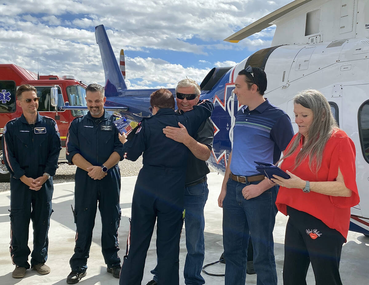 Gregory Herl embraces Air Methods nurse Beth Keuneman, who was on duty the night that Gregory w ...