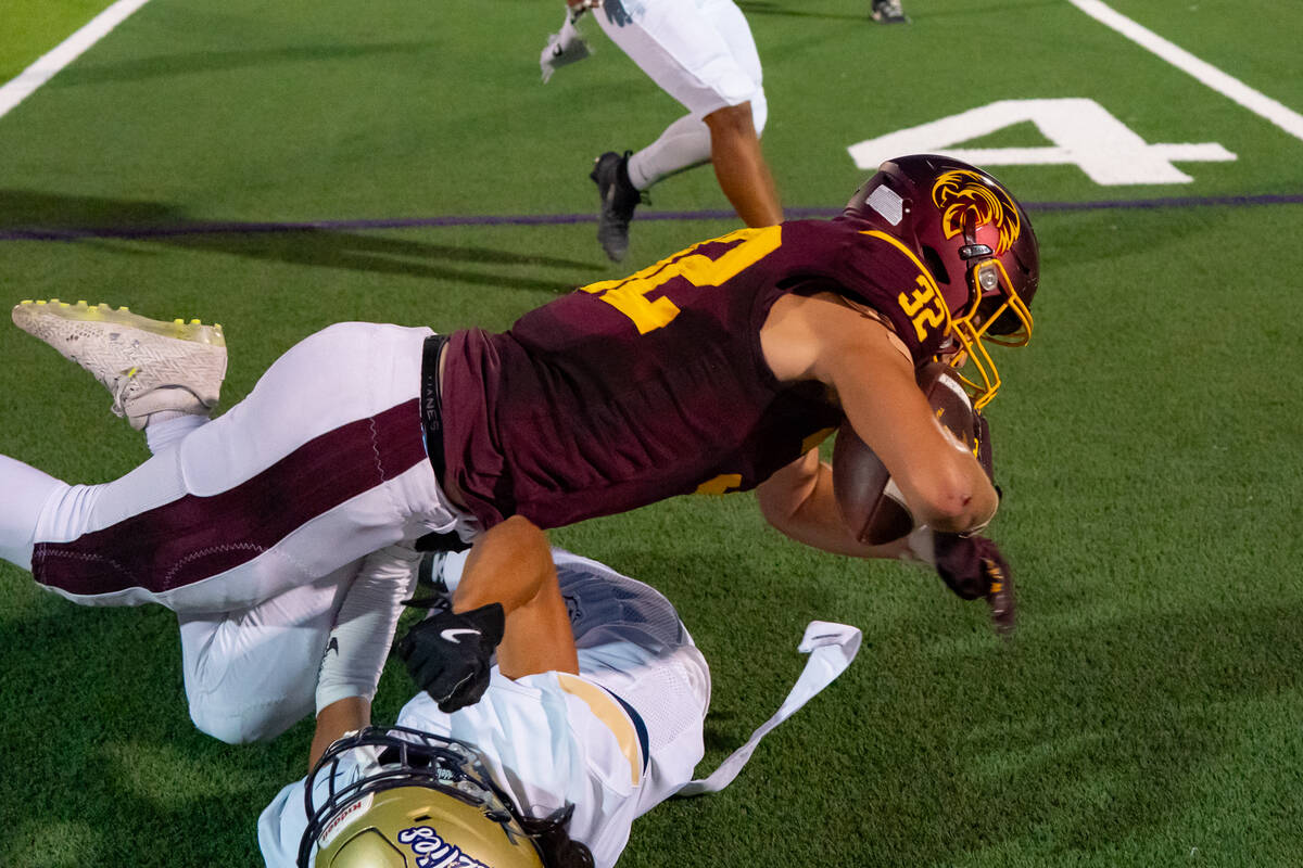 Pahrump Valley High School senior RB/LB Joshua Slusher puts on the hit stick against a Spring V ...