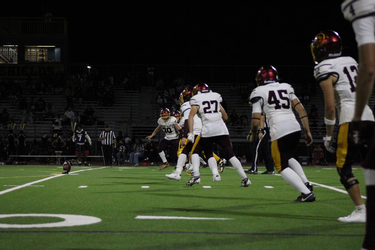Pahrump Valley High School quarterback Kayne Horibe prepares to kick off to Cheyenne High Schoo ...