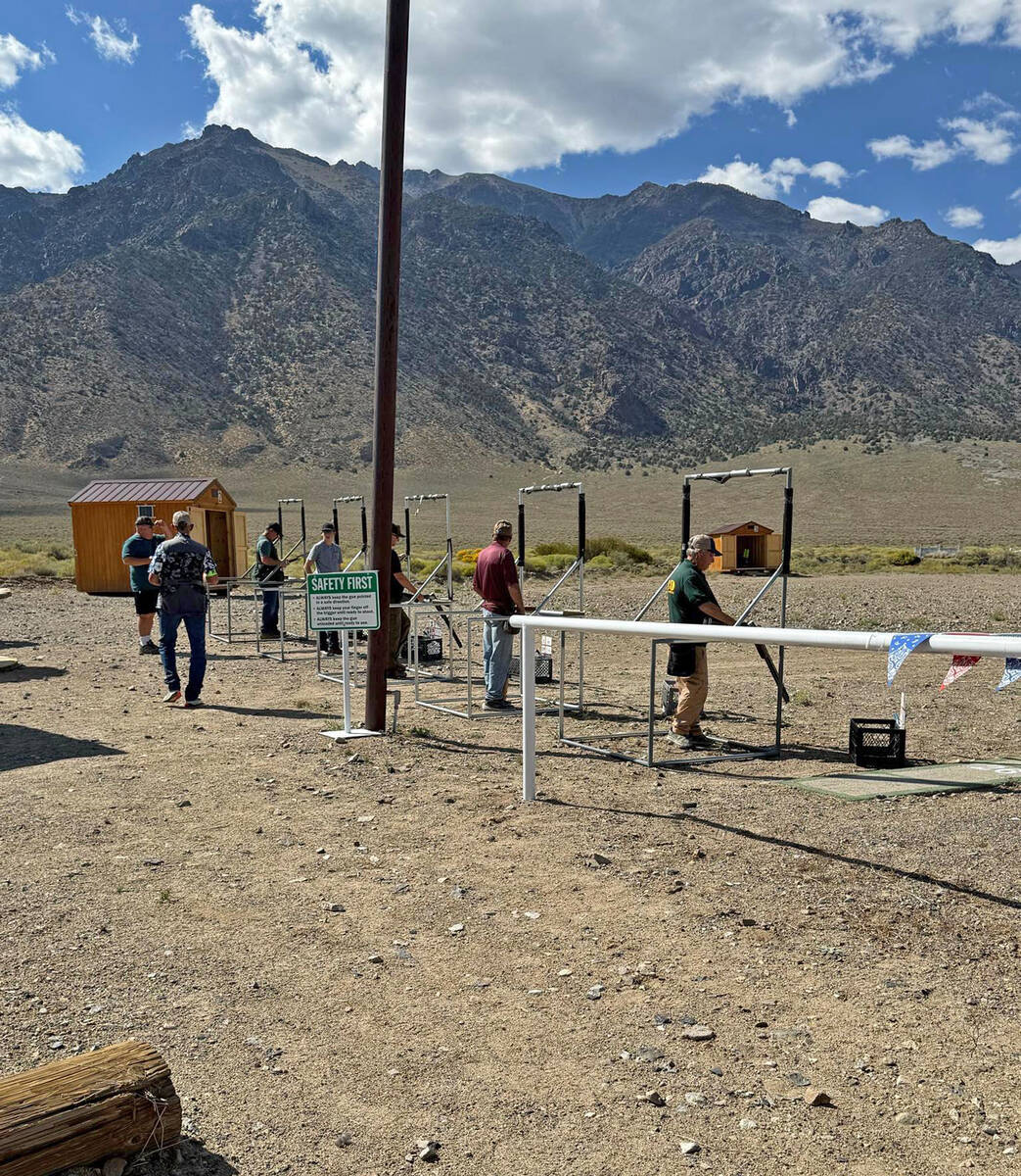 Members of the Smoky Valley Lead Wasters Club demonstrate a clay target shooting event called ' ...