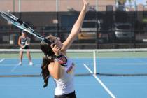 Pahrump Valley High School tennis junior Milly Khandpur sets up a serve in a road league match ...