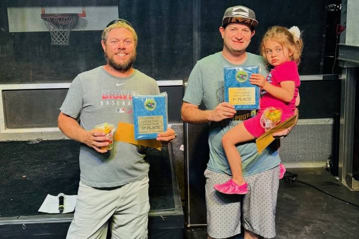 Southern Nevada Cornhole Society pitchers Josh Sharrer and Ethan Wald proudly show their first- ...