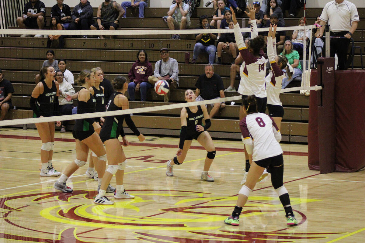 Pahrump Valley High School girls volleyball junior Xe'ane Kamanu and senior Marayah Waller get ...