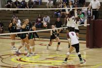 Pahrump Valley High School girls volleyball junior Xe'ane Kamanu and senior Marayah Waller get ...