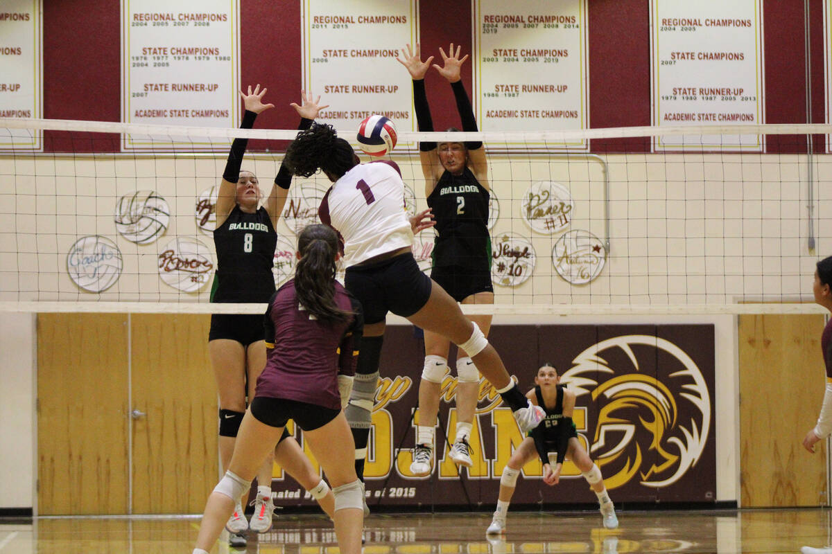 Pahrump Valley High School girls volleyball senior Heavenly Ware gets some air time during a ki ...