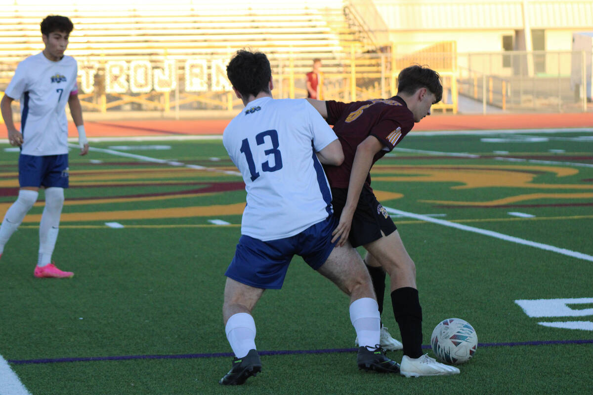PVHS boys soccer junior Samuel Mendoza traps the ball against a Boulder City defender during a ...