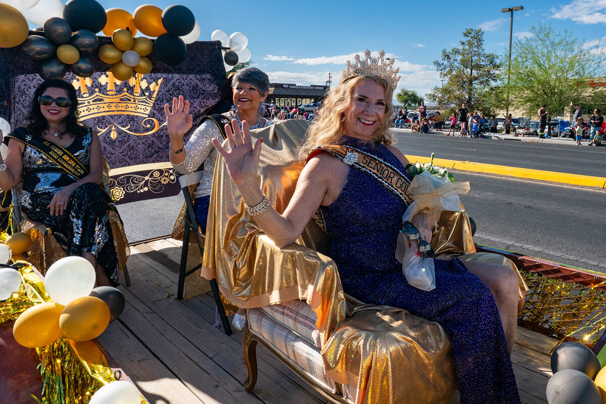 Ladies of the Ms. Senior Golden Years 2025 Queen's Court ride along in their float at the Pahru ...
