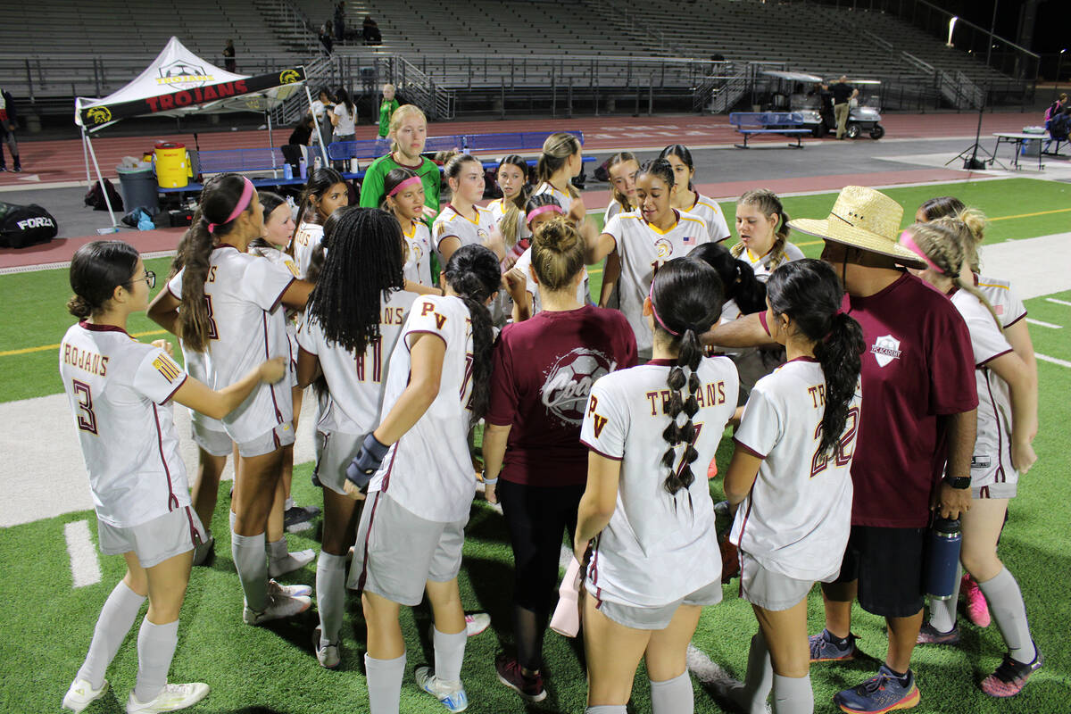 PVHS girls soccer coaches Amy Carlson and Victor Vallin lead the team in a closing huddle celeb ...