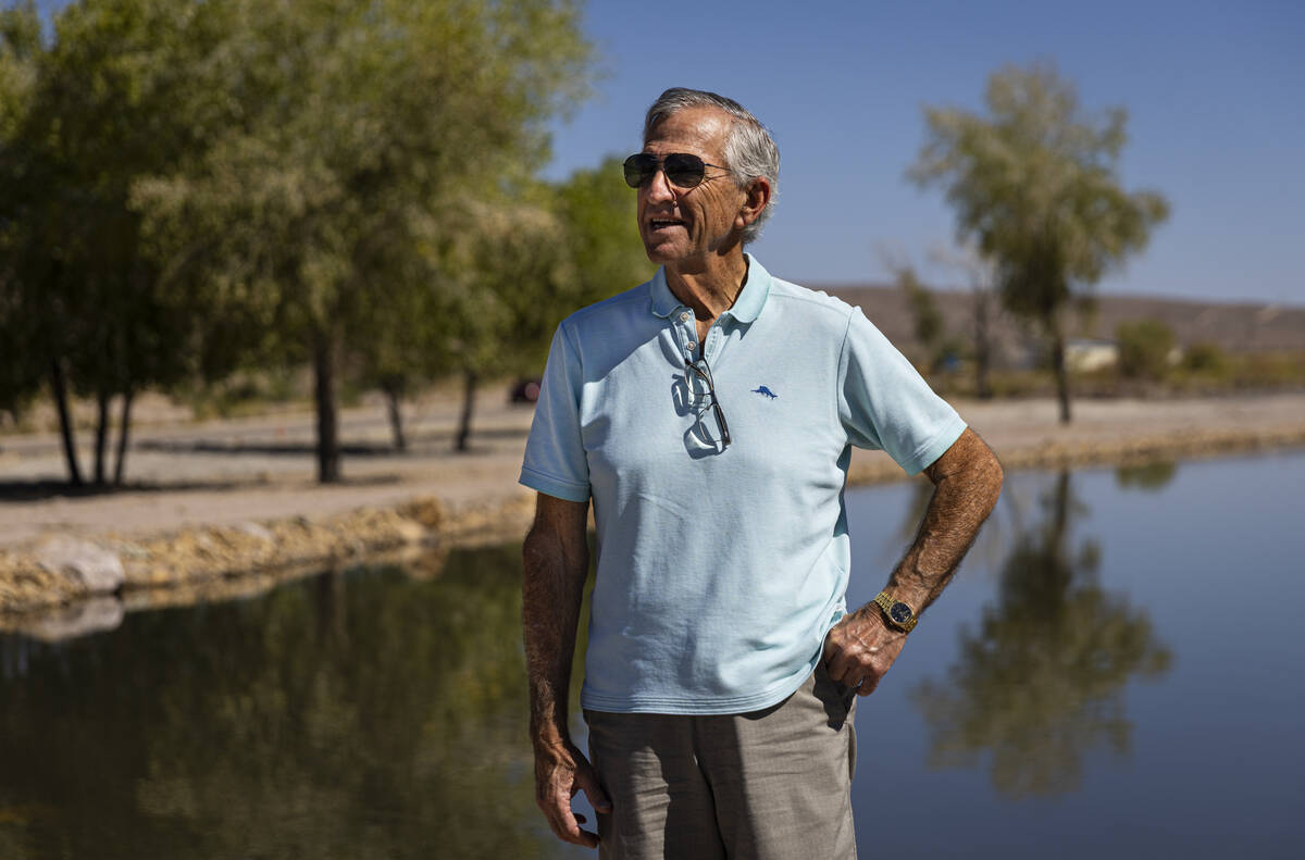 Ed Ringle poses for a portrait by a manmade pond on his private land, home to several natural s ...