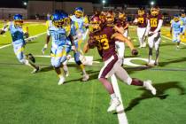 Pahrump Valley High School senior RB/FS Austin Alvarez carries the ball up the field in a home ...