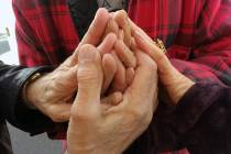 The late Tony (Lambardi) Laquidara clasped hands with fellow GriefShare founder members in a vi ...
