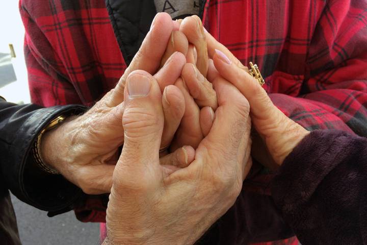 The late Tony (Lambardi) Laquidara clasped hands with fellow GriefShare founder members in a vi ...