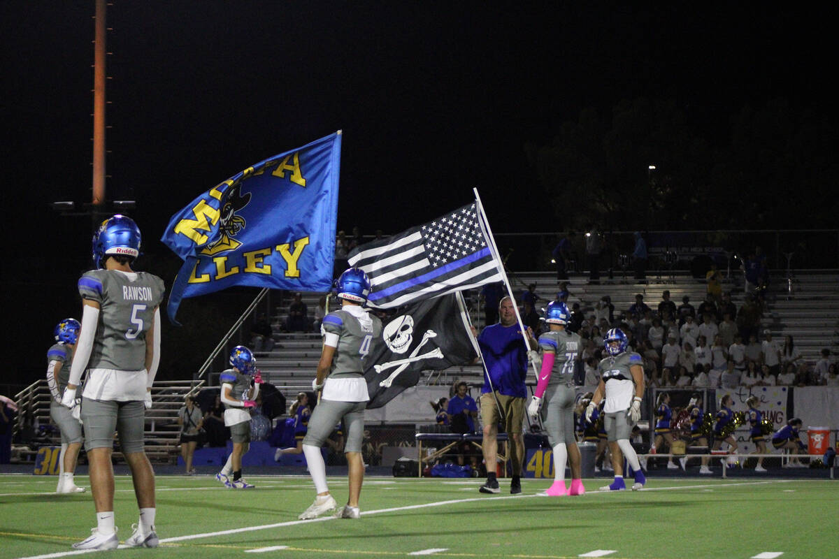 Moapa Valley proudly waves around their school flag and Blue Lives Matter flag before the start ...