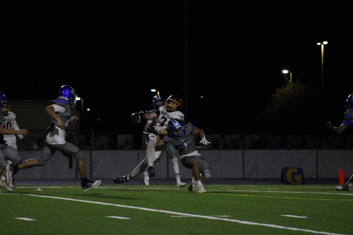 PVHS junior wideout Ryan Hamlin attempts to secure the ball in tight double coverage against th ...