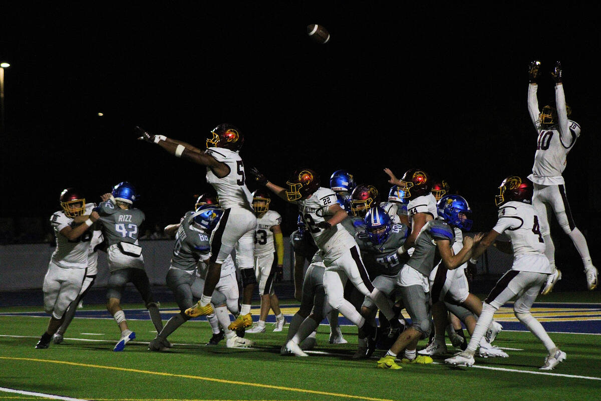 The Trojans special teams unit attempts to block a Moapa Valley point after attempt in an away ...