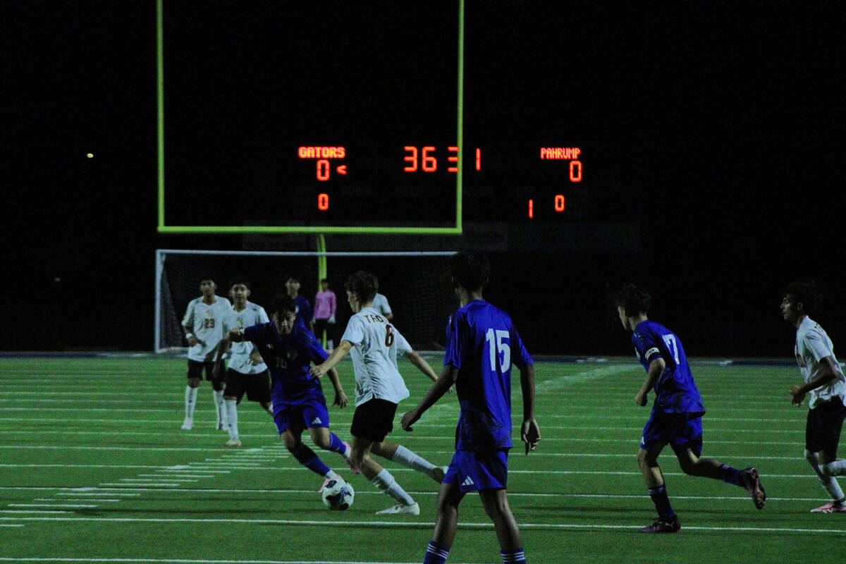 PVHS junior midfielder Samuel Mendoza splits a Green Valley defender in a non-league away match ...