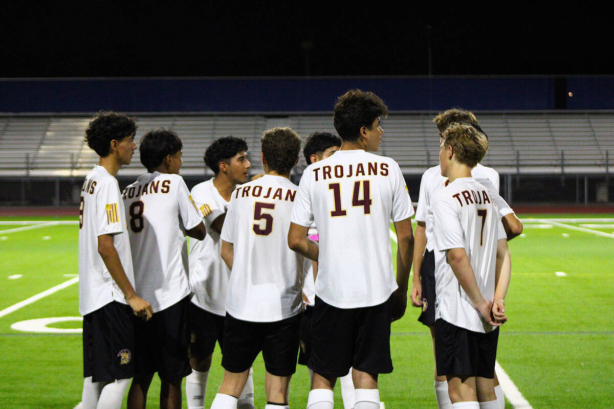 The Pahrump Valley High School varsity boys soccer team discusses at halftime their second half ...