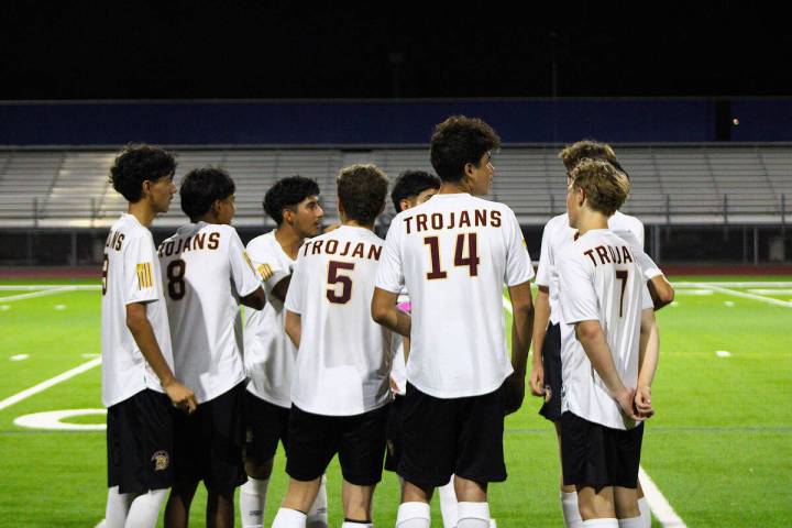 The Pahrump Valley High School varsity boys soccer team discusses at halftime their second half ...