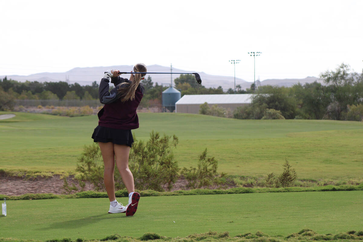 Pahrump Valley High School girls golf freshman Raegan Saldana drives her ball down the range du ...