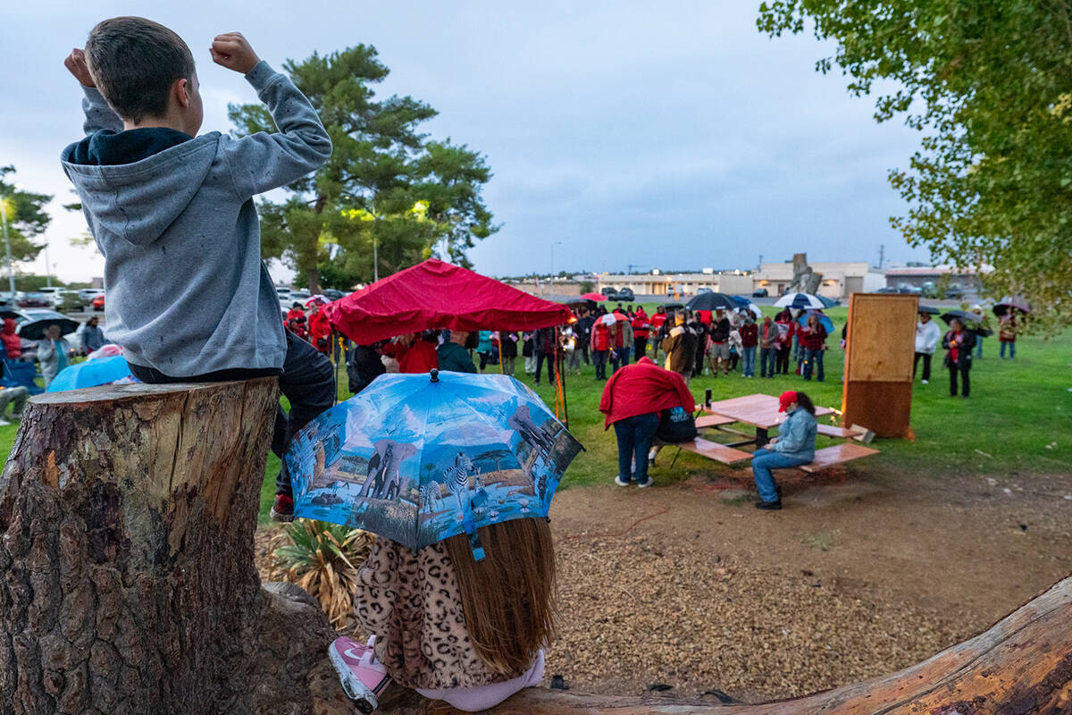 A large group of approximately 120 people gathered around the stand with Kirk’s portrait. (Jo ...