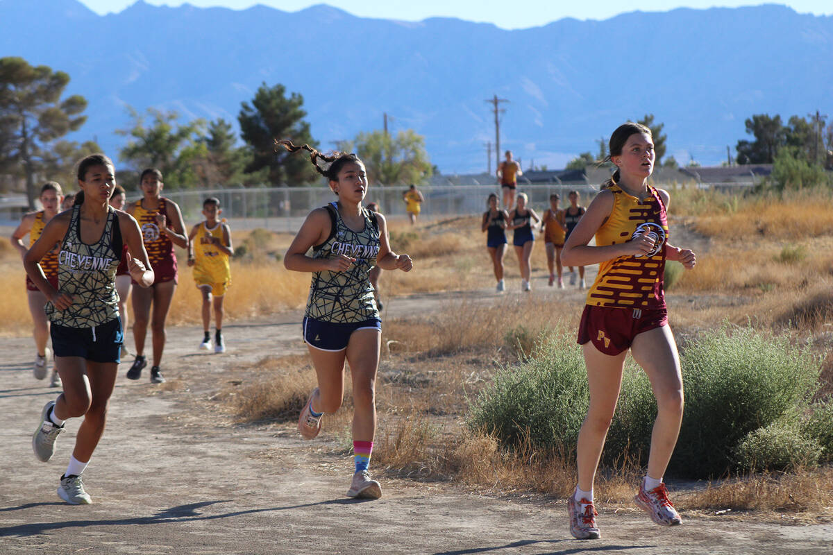 Runners from PVHS and Cheyenne High School come around the turn in the Pahrump Weekday home mee ...