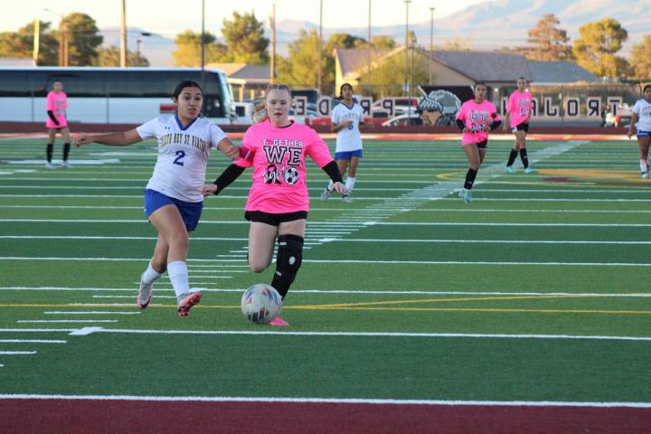 Pahrump Valley High School girls soccer senior co-captain Aubree Williams advances the ball dur ...