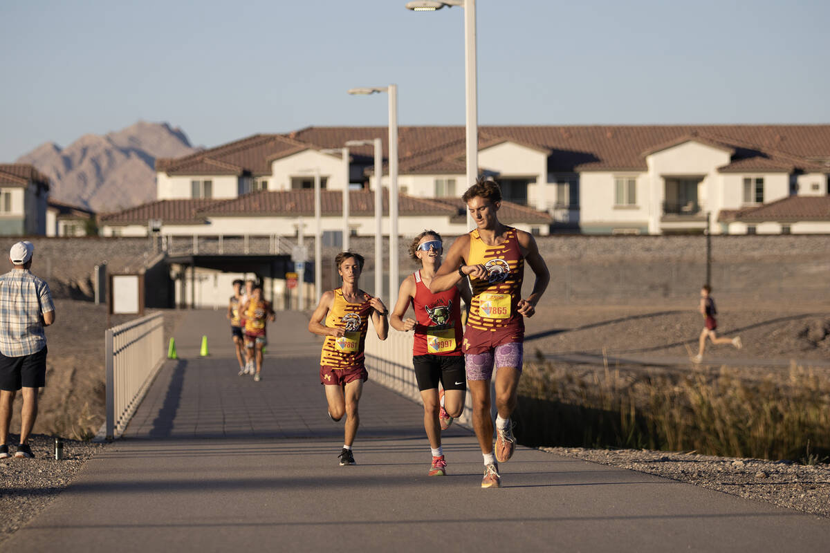 PVHS XC senior Aydon Veloz checks the current time on his watch during the Coaches Association ...