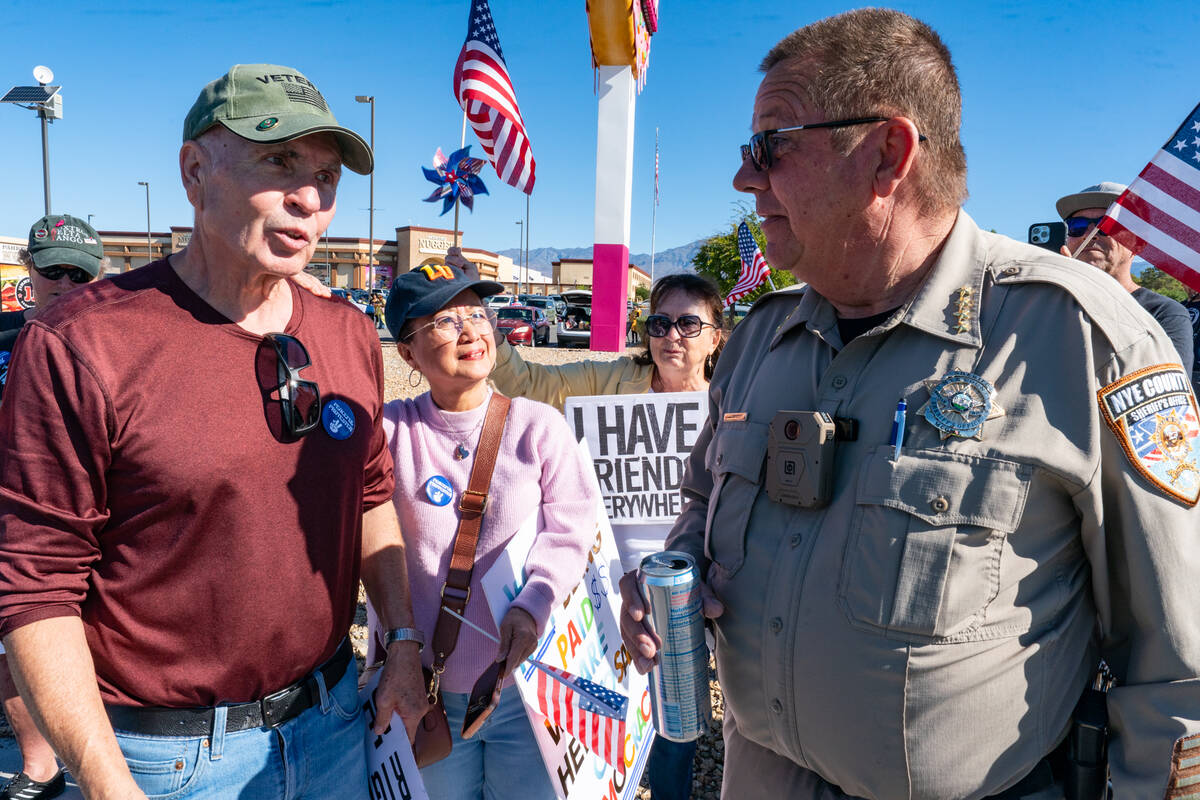 Sheriff Joe McGill, right, talks with a protester, ensuring the demonstration remained peaceful ...