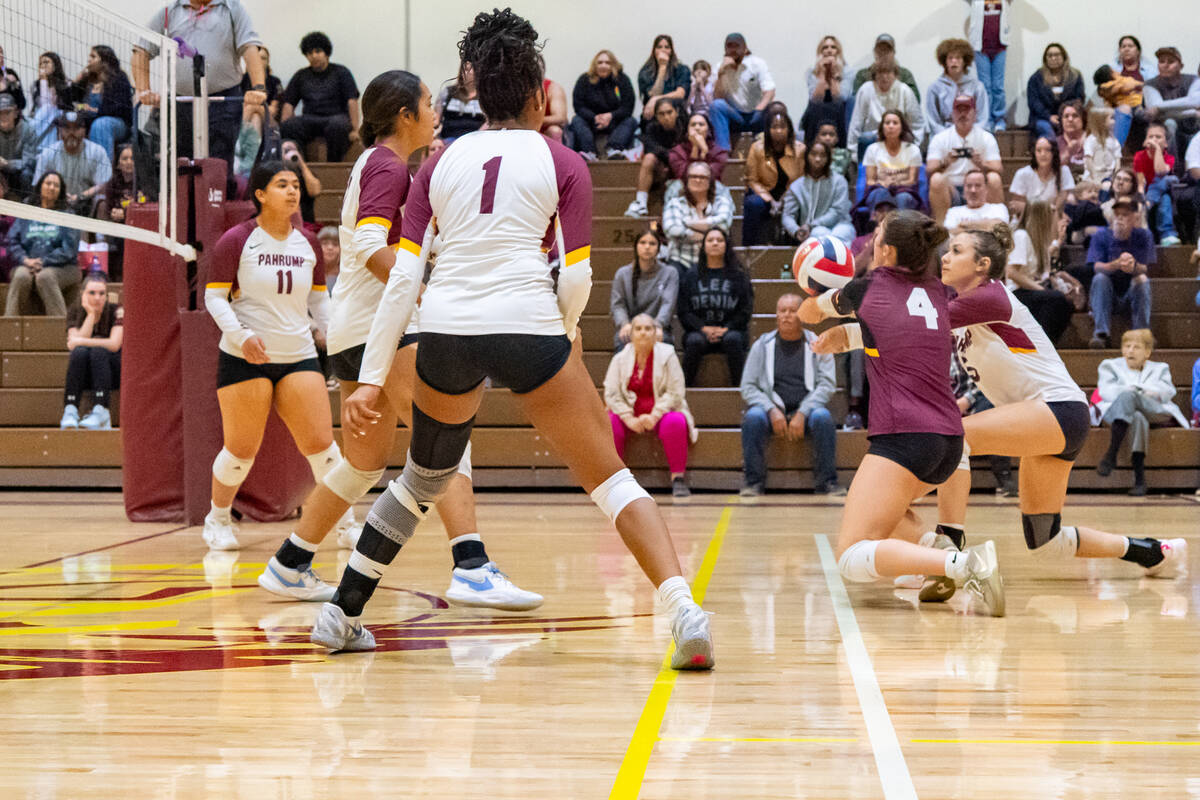 PVHS volleyball players Sedona Norton and Amaliah Mendoza try to dig out a low ball to keep the ...