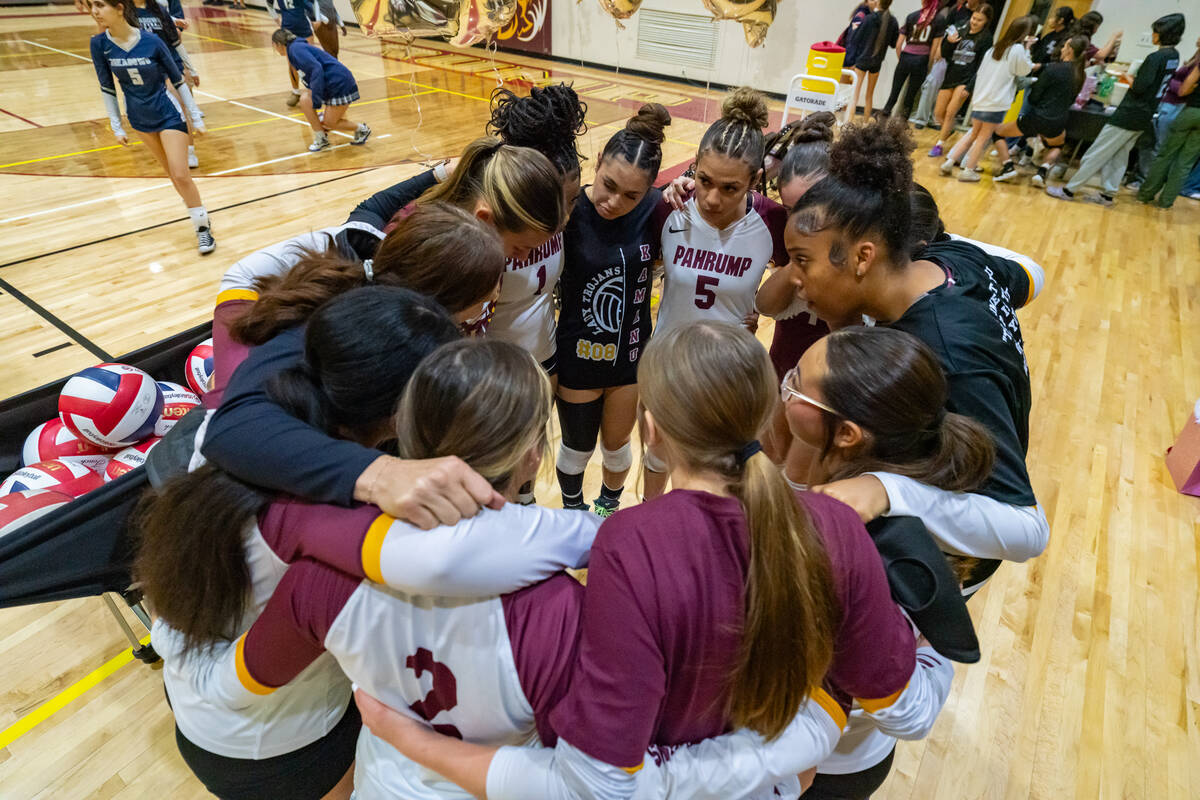 The Pahrump Valley High School girls varsity volleyball program huddles in for a quick team pra ...