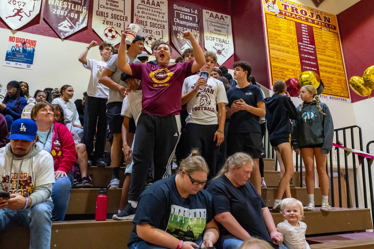 Pahrump Valley High School's Luca Blundo proudly leads the PVHS student section during the girl ...