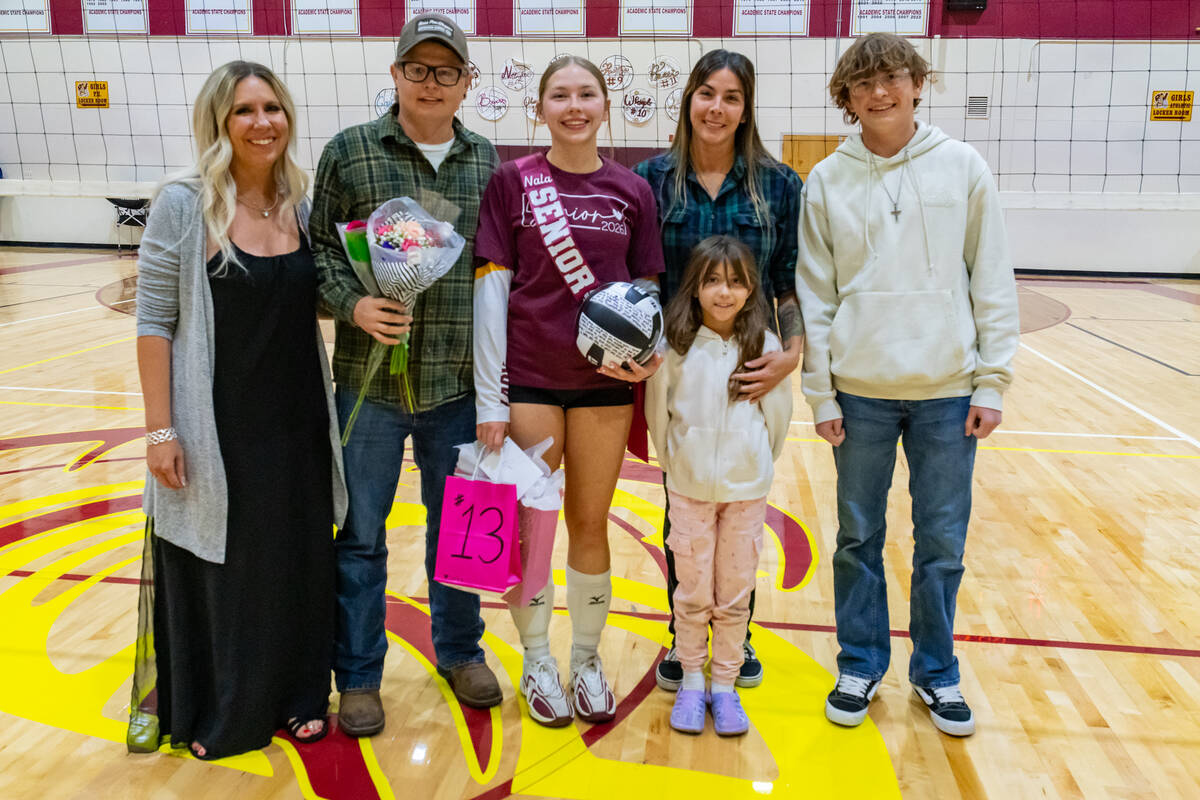 Pahrump Valley High School senior Nala Dalton proudly poses with members of her family during t ...