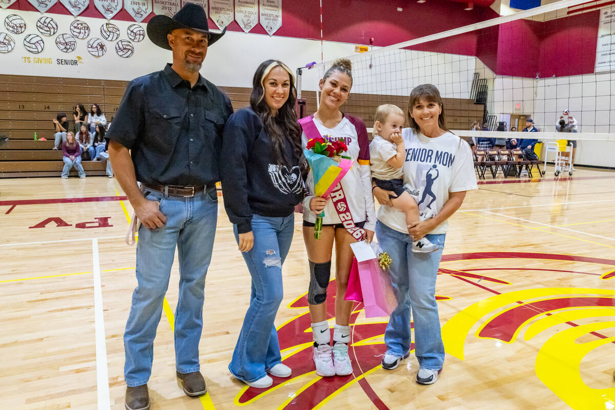 Pahrump Valley High School's senior Amaliah Mendoza proudly poses with members of her family be ...