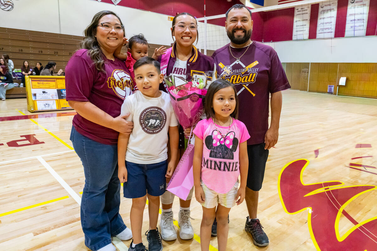 Pahrump Valley High School senior Madison Rodriguez proudly gets together with her family durin ...