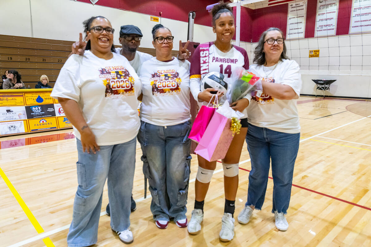 Pahrump Valley High School's senior Marayah Waller is joined by members of her family supportin ...