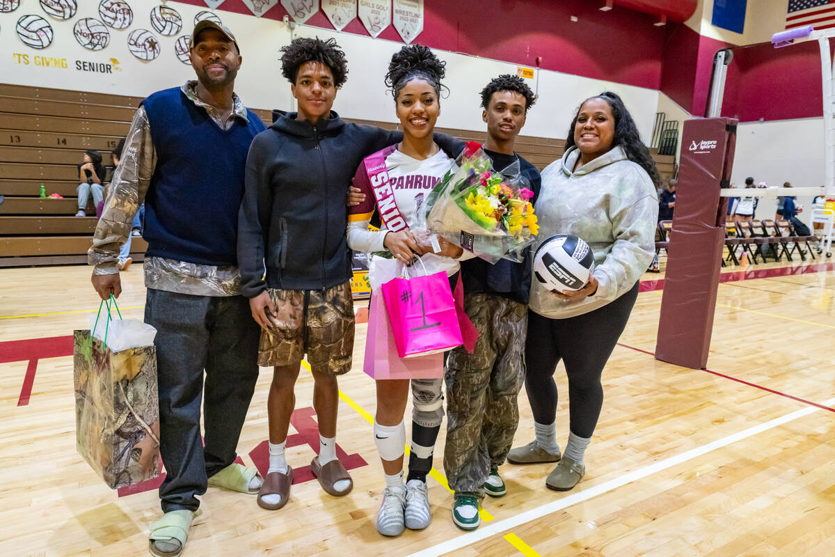 Pahrump Valley High School senior Heavenly Ware proudly poses with her family during the OH/RS/ ...