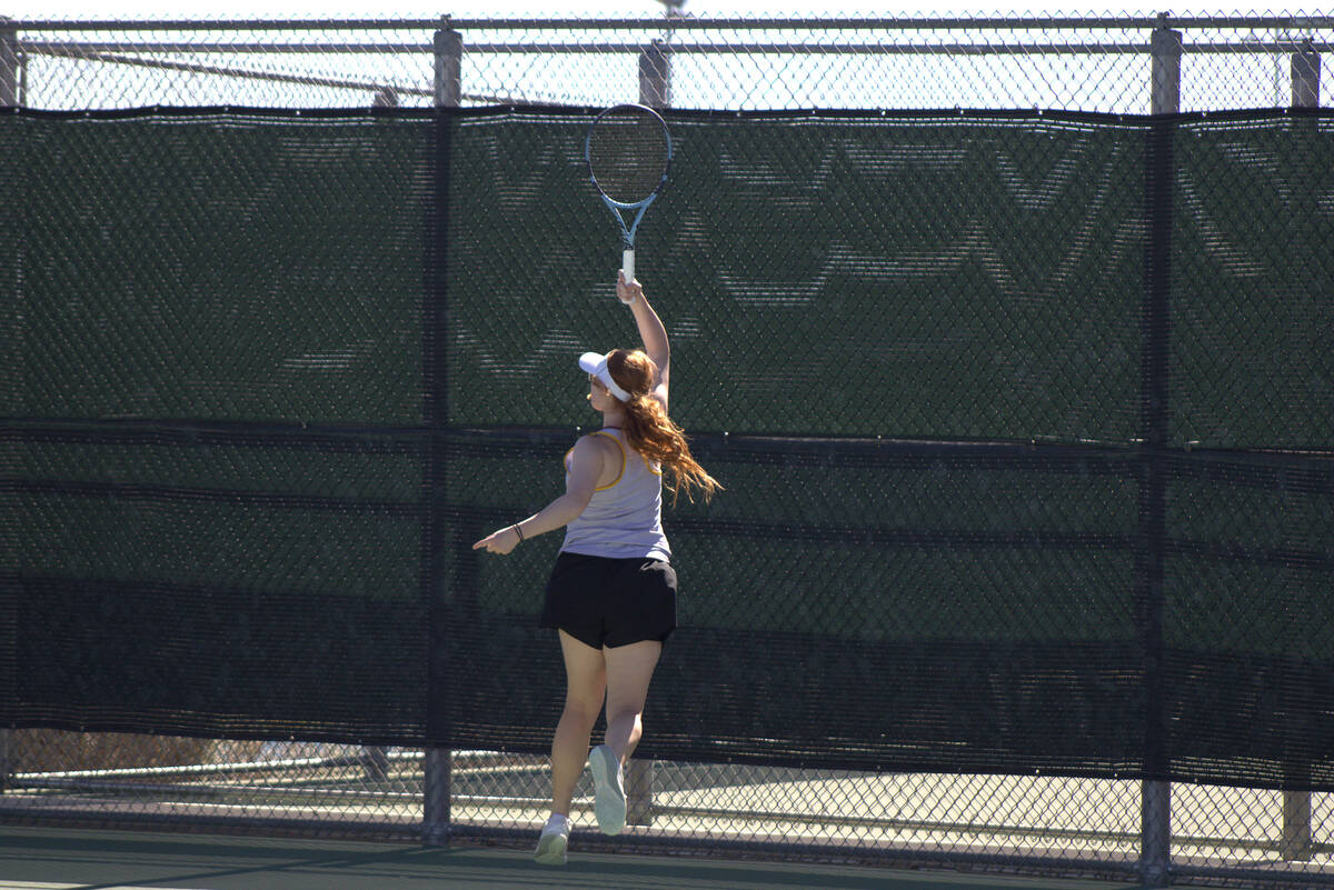 PVHS girls tennis sophomore Nyomi Skinner returns an improbable shot behind her back for a poin ...