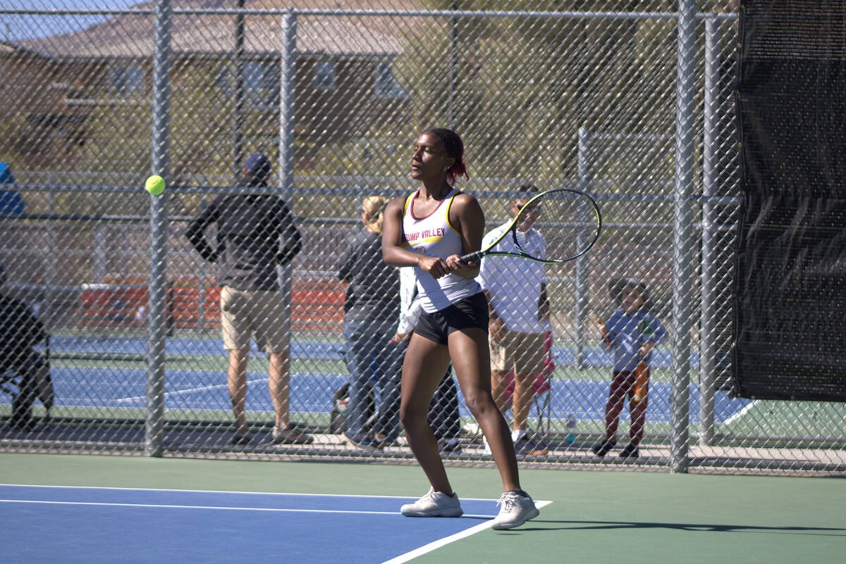 Pahrump Valley High School tennis junior Chanel Anthony returns a server against her opponent H ...