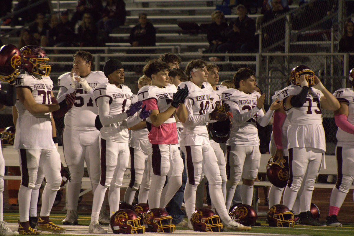 Members of the PVHS football program look on as they watch some of their senior teammates get h ...