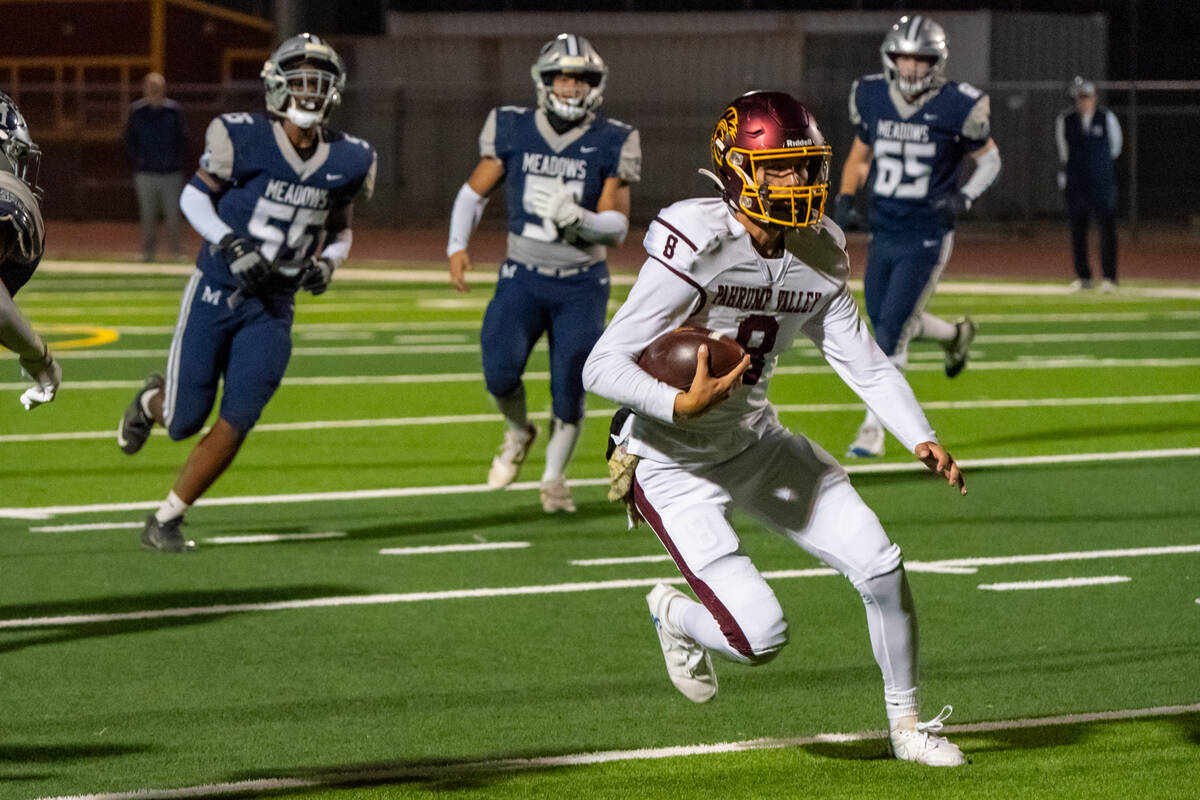 PVHS senior quarterback Kayne Horibe takes a rip down the field in a QB keeper that allows him ...