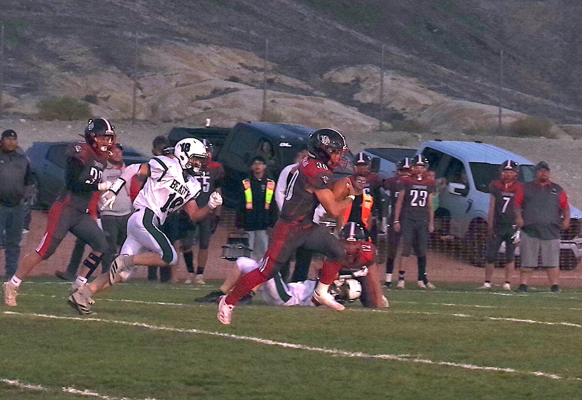 Tonopah Muckers QB/RB junior Dustin Otteson breaks of a big gain on the ground in a home game a ...