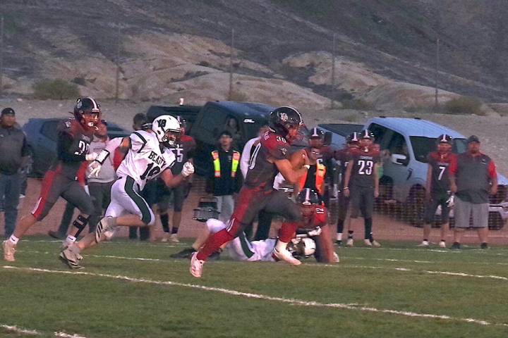 Tonopah Muckers QB/RB junior Dustin Otteson breaks of a big gain on the ground in a home game a ...