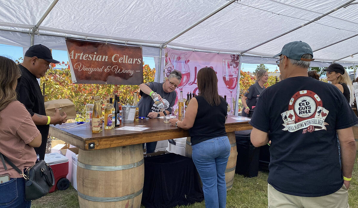 The large tent erected as the tasting area at the 17th Annual Grape Stomp saw a constant flow o ...