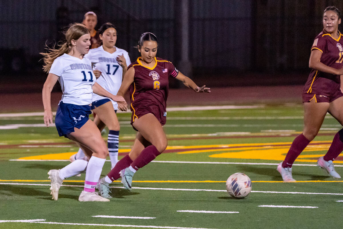 Pahrump Valley High School senior captain Natalia Vallin advances the ball up field during the ...