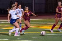 Pahrump Valley High School senior captain Natalia Vallin advances the ball up field during the ...