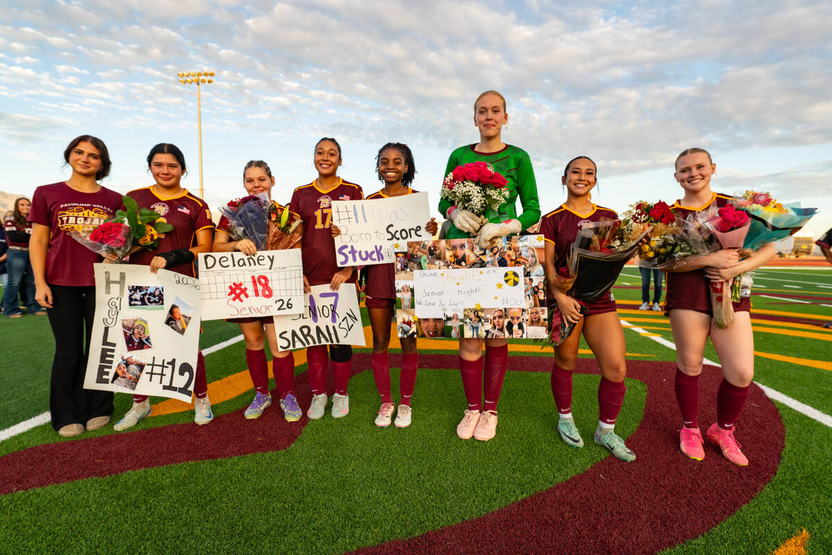 The 2025 Pahrump Valley High School girls soccer seniors line up before the start of their last ...