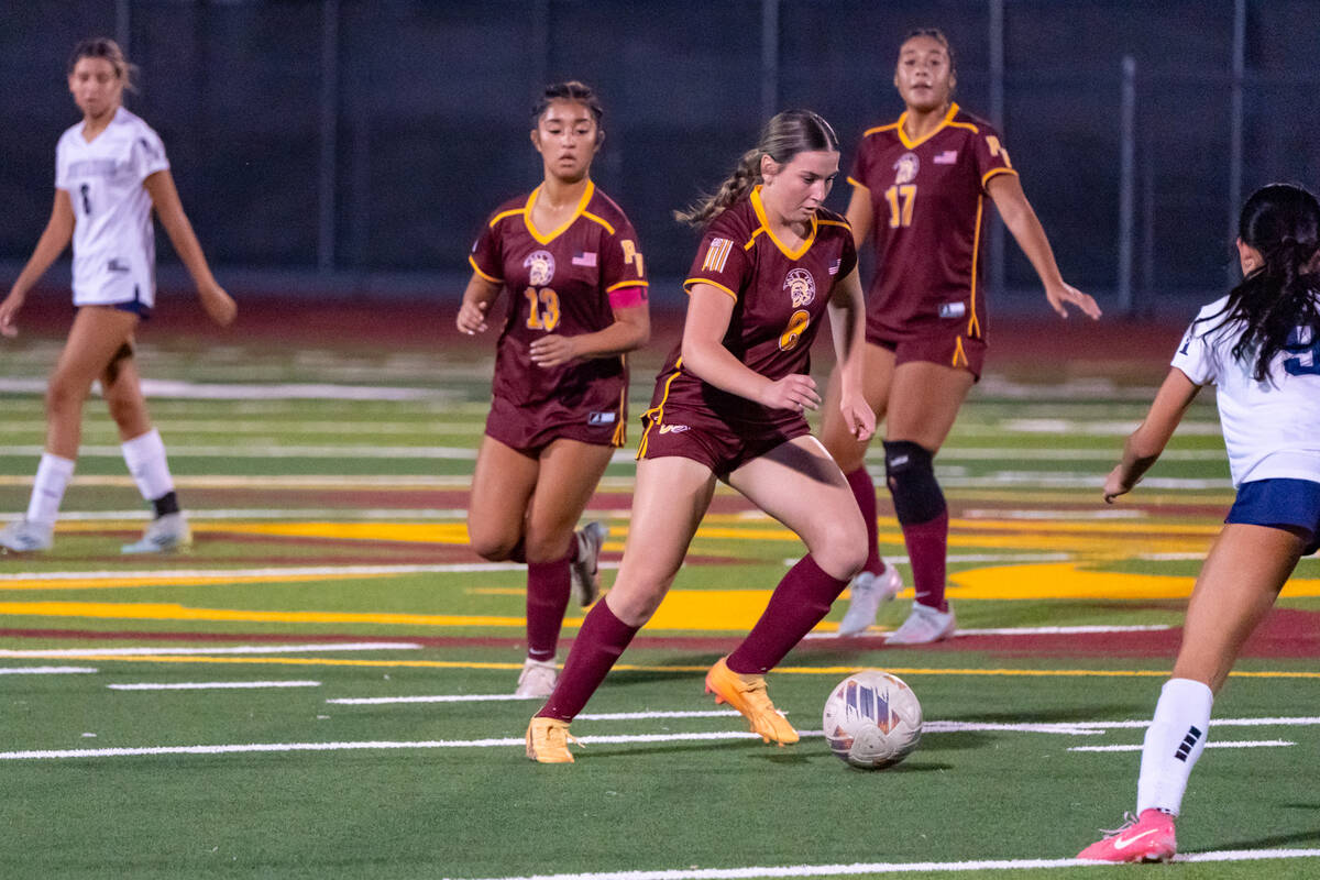 PVHS girls soccer junior Sydney Crotty maneuvers through a Mustangs defender in a home league m ...