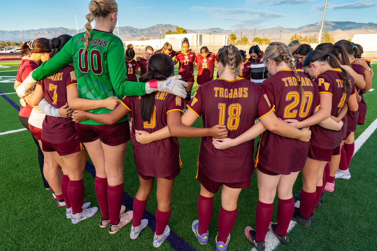 The PVHS girls soccer team gathers for a quick team prayer before their last regular season hom ...