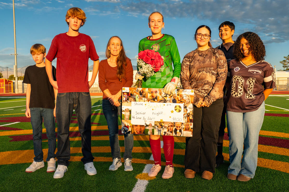 PVHS girls soccer senior goalkeeper Julieanne Briggs proudly poses on her senior night with fam ...